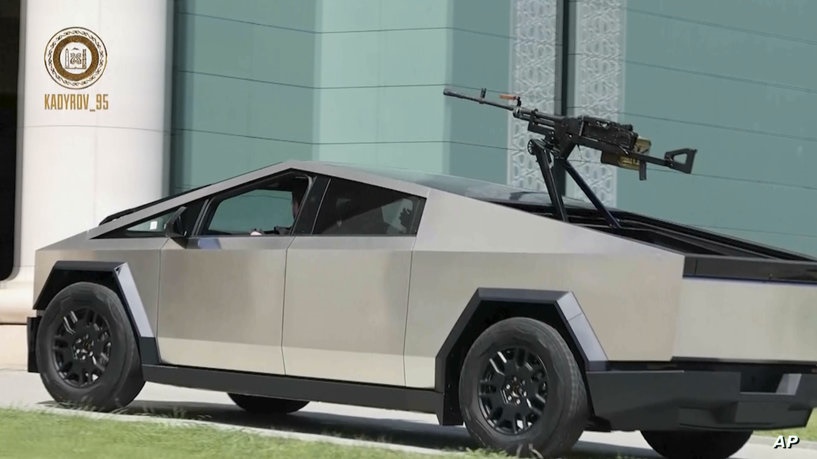 In this image from video posted by Chechen leader Ramzan Kadyrov’s Telegram channel on Saturday, Aug. 17, 2024, Kadyrov drives a Tesla Cybertruck equipped with a machine gun in Grozny, Chechnya. (Ramzan Kadyrov Telegram channel via AP)