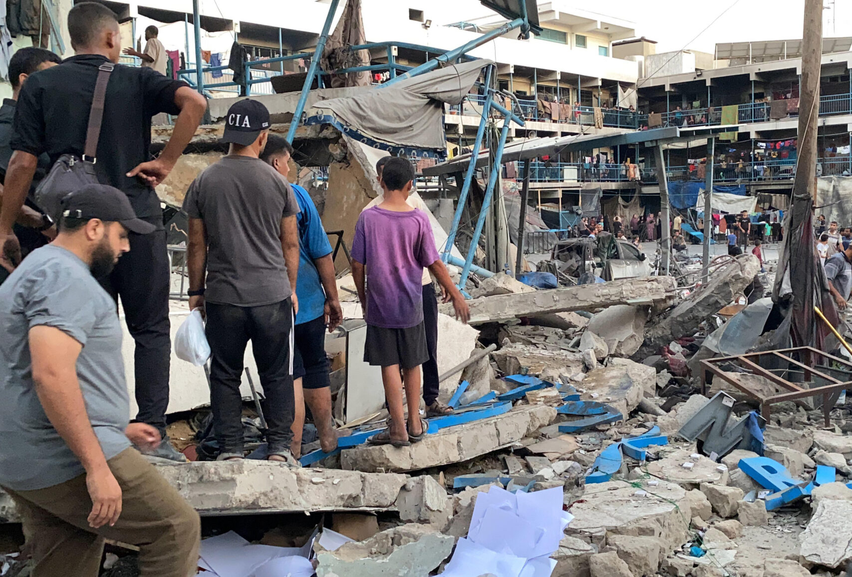 UN staff and Palestinians inspect the site after Israeli attack on a school of the United Nations Relief and Works Agency for Palestine Refugees in the Near East (UNRWA) in Gaza City, Gaza on July 18, 2024. Photo by Hadi Daoud  apaimages