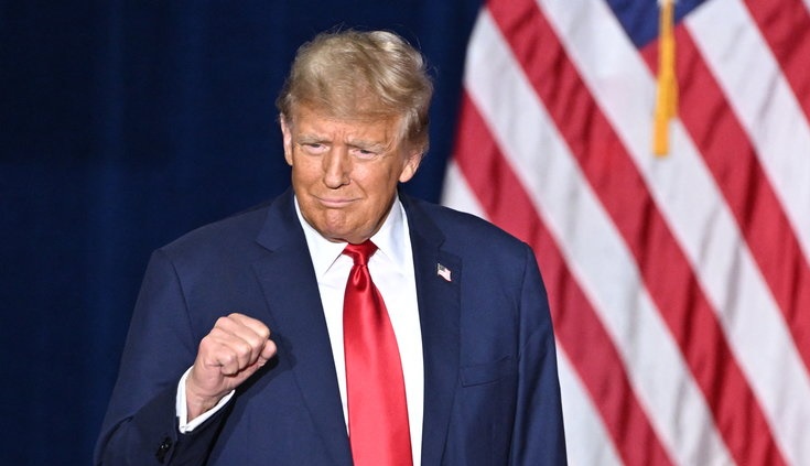 Former US President and Republican presidential hopeful Donald Trump arrives at a watch party during the 2024 Iowa Republican presidential caucuses in Des Moines, Iowa, on January 15, 2024. Trump told Americans Monday “it is time for our country to come together” after he won the Iowa caucuses, cementing his status as the likely Republican challenger to take on President Joe Biden in November’s election. (Photo by Jim WATSON / AFP)