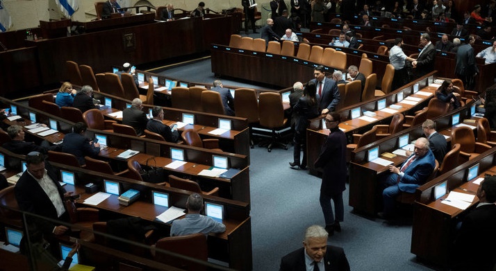 Israel’s lawmaker Yair Lapid, walks in the Israel’s parliament, the Knesset, as lawmakers convene for a vote on a contentious plan to overhaul the country’s legal system, in Jerusalem, February 20, 2023.  Maya Alleruzzo/Pool via REUTERS