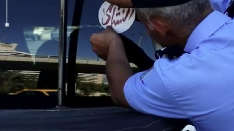 الأمن العام يوزع ملصقات داعمة للنشامى في مباريات كأس العالم